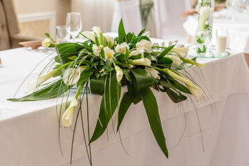 Beautiful decoration of the wedding holiday with flowers and greenery with florist decoration