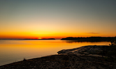 Fototapeta premium Scenic view of sunset by sea