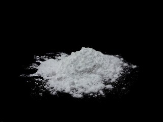 Obraz na płótnie Canvas Cocaine drug powder pile on black background