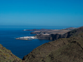 Fototapeta na wymiar Seascape view of Puerto de las Nieves, traditional fishing village port with cliffs and rocky atlantic coast in the north west of Gran Canaria, Canary Islands, Spain.