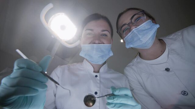POV shot of patient seeing female dentist during treat procrdure