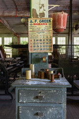 Old calendar hangs in abandoned factory