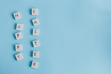 Happy Easter text putted vertically on blue light background,for easter card