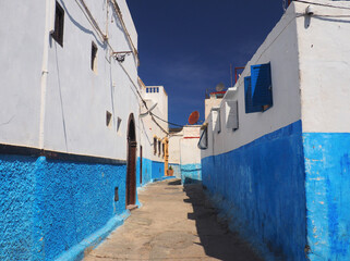 Mediterranean style white and blue moody streets. Old town in Rabat, the capital city of Morocco with characteristic white and blue walls paintings in narrow streets. 