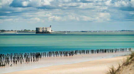 Fototapeta Fort Boyard in the Oleron Island during summer with turquoise ocean and scenic clouds obraz