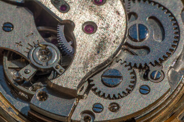 Vintage watch machine macro detail. Close up of old clock.