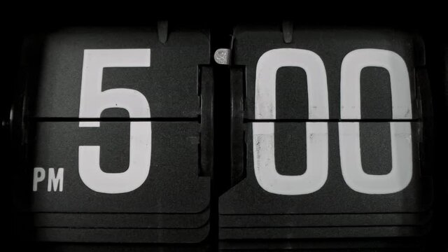 Retro flip clock switching from 4:59pm to 5:00pm; 1000fps slow motion, end of work day theme