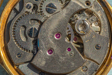 Fototapeta na wymiar Vintage watch machine macro detail. Close up of old clock.