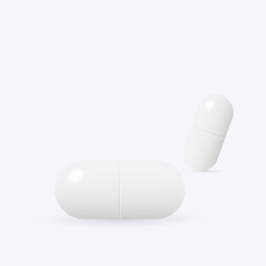 Two white medicine capsules.
