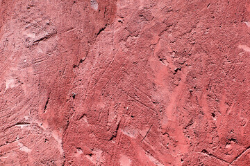 texture of cement-coated wall in red color