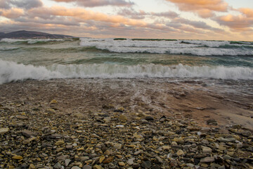 sea surf in the evening on a pebble beach