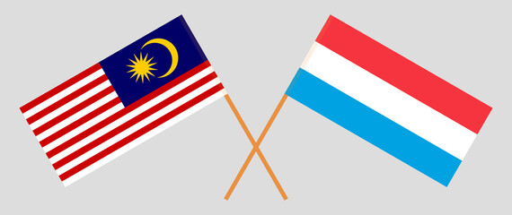 Crossed flags of Malaysia and Luxembourg. Official colors. Correct proportion