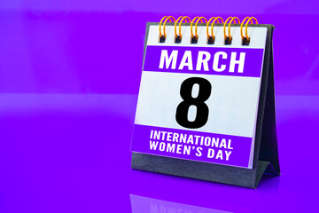 A calendar with March 8 St. International Women's Day date on a purple background