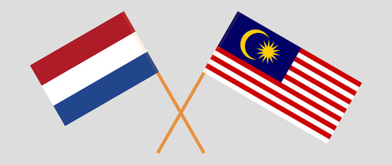 Crossed flags of the Netherlands and Malaysia. Official colors. Correct proportion