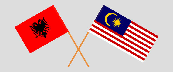 Crossed flags of Albania and Malaysia. Official colors. Correct proportion