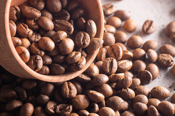 Coffee beans in a wooden cup
