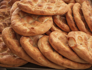 Close up of special Turkish Ramadan Pita. Turkish Ramadan bread. Traditional Ramadan food as known Pide. Turkish bread with sesame and nigella seeds. Turkish Ramadan Pita or Ramazan Pidesi. 