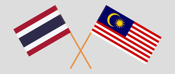 Crossed flags of Thailand and Malaysia. Official colors. Correct proportion