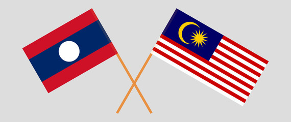 Crossed flags of Laos and Malaysia. Official colors. Correct proportion