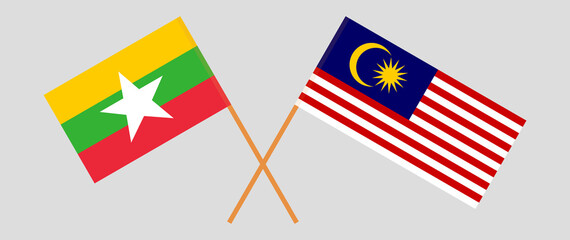 Crossed flags of Myanmar and Malaysia. Official colors. Correct proportion