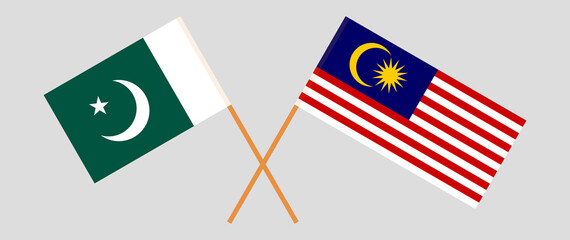 Crossed flags of Pakistan and Malaysia. Official colors. Correct proportion