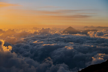 Beautiful sunset at the top of the Acatenango volcano with view to the volcanic chain of Guatemala...