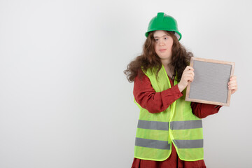 Image of a young cute girl with down syndrome standing in vest