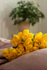 A bouquet of yellow tulips. Bouquet of fresh tulips close-up. Spring flowers in the interior. The concept of spring or holiday, March 8, International Women's Day