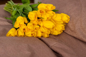 A bouquet of yellow tulips. Bouquet of fresh tulips close-up. Spring flowers in the interior. The concept of spring or holiday, March 8, International Women's Day,