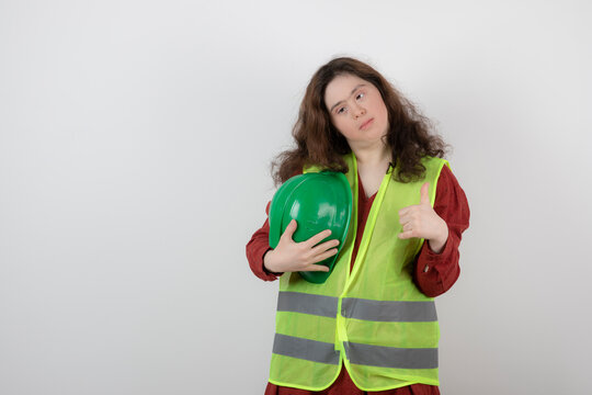 Image of a young cute girl with down syndrome standing in vest 