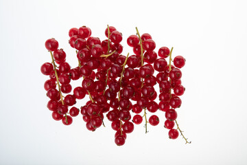 Fresh raw red currant berries isolated on white