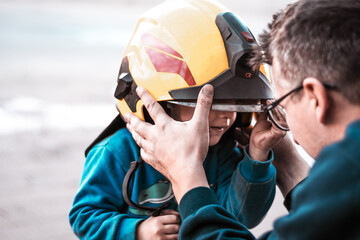 Portrait of a firefighter with a boy standing