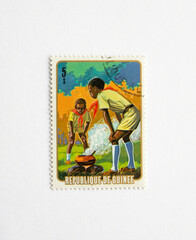  Guinea Republic Postage Stamp. circa 1974. boy scouts are cooking
