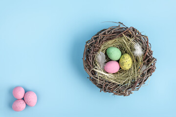 Top view of easter egg nest flat lay. Minimal holiday season concept background. Copy space for text