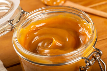 Close-up of jar full of dulce de leche. Dulce de leche, traditional sweet in Latin America.