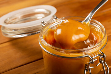 Close-up of jar full of dulce de leche. Dulce de leche, traditional sweet in Latin America.