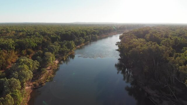 Aerial view of a river in the middle of lush forest, Australian outback, Darwin, Australia.