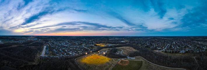 Aerial view of artificallly lit baseball field during sunset in one of the neighborhoods of Lexington, Kentucky