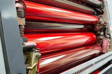 Komori, Color and glossy rollers of offset printing machine. offset ink colour. magenta, red.