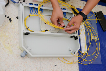 Technicians are cutting and fusion fiber optic cables.