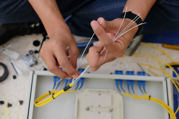 Technicians are cutting and fusion fiber optic cables.