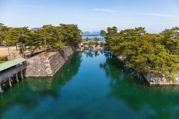Naklejka premium Japanese garden and moat , Takamatsu city, kagawa, shikoku, Japan