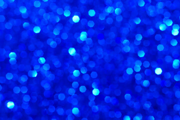 Abstract dark aquamarine and blue glitter lights background. Blurred bokeh. Festive backdrop for Christmas, holiday, event. Winter card or invitation