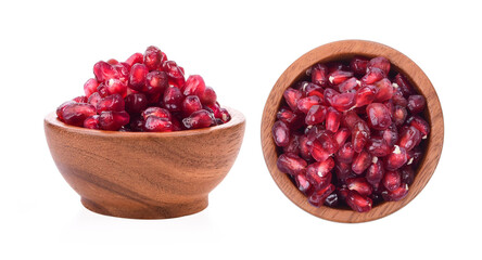 Fruit pomegranate in wood bowl on white background