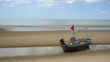 Fototapeta premium A fisherman boat was on the beach area, Hua Hin Thailand