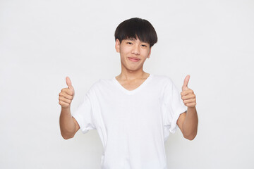 Asian young man going thumb up