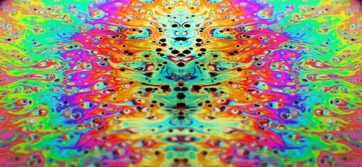 Obraz na płótnie Canvas Macro photo of a soap-bubble in the colors of a rainbow
