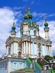 antique beautiful St Andrey Cathedral in Kiev, Ukraine. heritage church on blue sky with white clouds in sunny day. Europe travel diversity