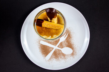 traditional Italian sweet tiramisu cake dessert in decorate dish