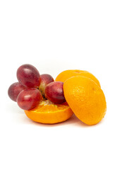 Citrus fruits and grapes on white background